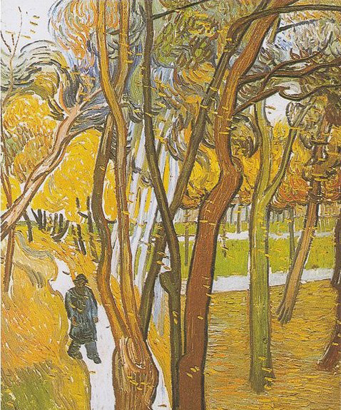 Walkers in the park with falling leaves